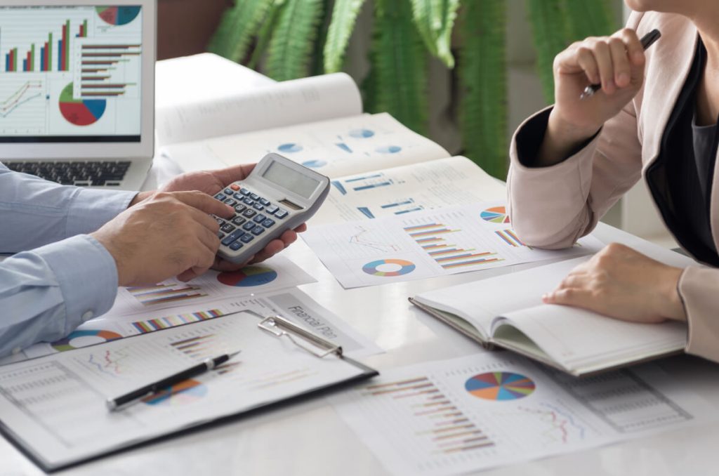 Bookkeeper going over financial information with business owner