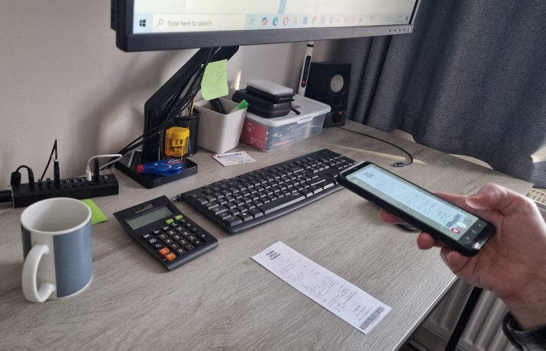 Taking a photo of a receipt using a smartphone from within a receipt capture app